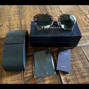 Look fantastic with these fashionable and sleek Prada sunglasses!